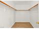 Spacious walk-in closet with rod racks for optimal organization and storage at 4007 W Red Coach Ave, North Las Vegas, NV 89031