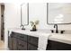 Modern bathroom featuring dual sinks with quartz countertop and black fixtures at 4016 Tyler William Ln, Las Vegas, NV 89130