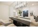 Open dining room featuring modern lighting, stylish decor, and seamless flow to the living areas at 4016 Tyler William Ln, Las Vegas, NV 89130
