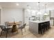 Bright kitchen with a spacious island, modern lighting, and a cozy breakfast nook area at 4016 Tyler William Ln, Las Vegas, NV 89130