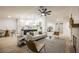 Open-concept living space with a modern kitchen, dining area, and cozy seating arrangement at 4016 Tyler William Ln, Las Vegas, NV 89130