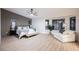 Serene main bedroom suite with large windows, a seating area, and contemporary decor at 4016 Tyler William Ln, Las Vegas, NV 89130