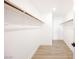 Spacious walk-in closet with wooden rails for clothing storage, and bright floors at 4016 Tyler William Ln, Las Vegas, NV 89130