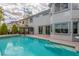 Lush backyard showcasing a pool, spa, and lovely landscaping at 44 Tamarron Cliffs St, Las Vegas, NV 89148