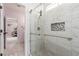 Modern bathroom featuring glass shower door, niche and safety bars at 44 Tamarron Cliffs St, Las Vegas, NV 89148