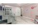 Stylish pink bedroom featuring bunkbeds with built in stairs, pink accents and hardwood flooring at 44 Tamarron Cliffs St, Las Vegas, NV 89148