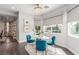 Charming dining area with bright, natural light, modern decor, and a view of the backyard pool at 44 Tamarron Cliffs St, Las Vegas, NV 89148