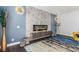 Close up of a modern fireplace with stone detail, lighting, and decor at 44 Tamarron Cliffs St, Las Vegas, NV 89148