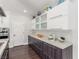 Kitchen featuring modern cabinetry, a stylish backsplash, and a functional layout for cooking and storage at 44 Tamarron Cliffs St, Las Vegas, NV 89148