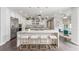 A kitchen that showcases a spacious island with seating, modern appliances, and an adjacent breakfast area at 44 Tamarron Cliffs St, Las Vegas, NV 89148