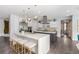 Modern kitchen with a large island, stainless steel appliances, and custom cabinetry at 44 Tamarron Cliffs St, Las Vegas, NV 89148