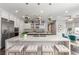 Bright kitchen features a marble island, stainless appliances, and custom lighting at 44 Tamarron Cliffs St, Las Vegas, NV 89148