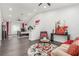 Spacious living room featuring an open layout, hardwood floors, and stairs to the second floor at 44 Tamarron Cliffs St, Las Vegas, NV 89148