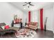 Cozy living room featuring hardwood floors, modern decor, and bright natural lighting at 44 Tamarron Cliffs St, Las Vegas, NV 89148