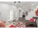 Open-concept living room with modern furnishings, stylish decor, and hardwood floors at 44 Tamarron Cliffs St, Las Vegas, NV 89148