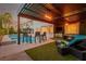 This covered patio provides a comfortable spot to enjoy the pool and backyard, creating a perfect outdoor oasis at 44 Tamarron Cliffs St, Las Vegas, NV 89148