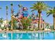 Resort-style community pool area with water park features and mature landscaping at 44 Tamarron Cliffs St, Las Vegas, NV 89148