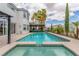 Inviting backyard pool and spa offer a tranquil escape, complemented by a covered patio at 44 Tamarron Cliffs St, Las Vegas, NV 89148