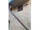 Exterior view of the building with unit number, showing stucco siding and stairs at 4748 Obannon Dr # C, Las Vegas, NV 89102