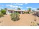 Well-maintained backyard with ample space and mature trees, creating a private oasis at 5705 Sovereign Way, Las Vegas, NV 89130