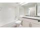 Bright bathroom with a tub, vanity, and grey countertop at 5705 Sovereign Way, Las Vegas, NV 89130