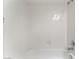 Bathtub with full shower and white tile surround at 5705 Sovereign Way, Las Vegas, NV 89130