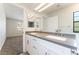 Bathroom with dual sinks and grey countertops at 5705 Sovereign Way, Las Vegas, NV 89130