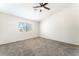 Bright bedroom with a ceiling fan and large window at 5705 Sovereign Way, Las Vegas, NV 89130
