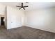 Large carpeted bedroom with ensuite bathroom entrance at 5705 Sovereign Way, Las Vegas, NV 89130