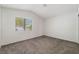 Cozy bedroom with neutral carpet, a window for natural light, and ample space at 5705 Sovereign Way, Las Vegas, NV 89130