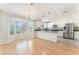 Bright dining area with large windows, stylish lighting, and a view of the modern kitchen at 5705 Sovereign Way, Las Vegas, NV 89130