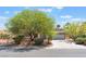 A charming single-story home with a well-manicured front yard and a two-car garage at 5705 Sovereign Way, Las Vegas, NV 89130