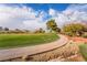 Well-maintained golf course featuring lush green grass and a scenic walking path at 5705 Sovereign Way, Las Vegas, NV 89130