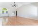 Inviting living room with hardwood floors, a double-door entryway, and natural light at 5705 Sovereign Way, Las Vegas, NV 89130