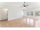 Spacious living room with hardwood floors, ceiling fan, and access to the backyard at 5705 Sovereign Way, Las Vegas, NV 89130