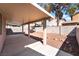 Spacious covered back patio with concrete flooring and low-maintenance desert landscaping at 5978 Autumn Harvest Ave, Las Vegas, NV 89142