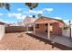 Backyard featuring a covered patio, a rock garden, and a low block wall at 5978 Autumn Harvest Ave, Las Vegas, NV 89142