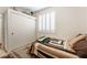 Bedroom featuring a large window with plantation shutters and a closet with sliding doors at 5978 Autumn Harvest Ave, Las Vegas, NV 89142