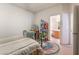 Inviting bedroom with an adjacent bathroom and plenty of natural light at 5978 Autumn Harvest Ave, Las Vegas, NV 89142