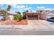 Charming single-story home with desert landscaping and a two-car garage at 5978 Autumn Harvest Ave, Las Vegas, NV 89142