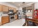 Kitchen featuring stainless steel appliances and a sliding glass door to patio at 5978 Autumn Harvest Ave, Las Vegas, NV 89142