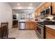 Bright kitchen with stainless steel appliances and wood cabinets at 5978 Autumn Harvest Ave, Las Vegas, NV 89142