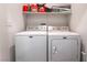 Laundry room featuring a side-by-side washer and dryer, and a shelf at 5978 Autumn Harvest Ave, Las Vegas, NV 89142