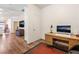 Office space boasts wood floors, a desk, and great natural light at 5978 Autumn Harvest Ave, Las Vegas, NV 89142