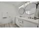 Bathroom with double sink vanity, stylish fixtures, and modern mirrors at 6128 Casper Sands Ct, North Las Vegas, NV 89031