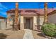 Inviting single-story home with a tiled roof, desert landscape, and a covered entryway at 6128 Casper Sands Ct, North Las Vegas, NV 89031