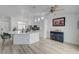 Modern kitchen with white cabinets, island seating, and stainless steel appliances at 6128 Casper Sands Ct, North Las Vegas, NV 89031