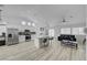 Open-concept kitchen featuring stainless steel appliances and a large island with bar seating at 6128 Casper Sands Ct, North Las Vegas, NV 89031