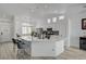 Bright kitchen showcasing an island with a marbled countertop and stainless steel appliances at 6128 Casper Sands Ct, North Las Vegas, NV 89031