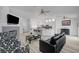 Bright living room flows into an open kitchen, creating an ideal space for entertaining at 6128 Casper Sands Ct, North Las Vegas, NV 89031